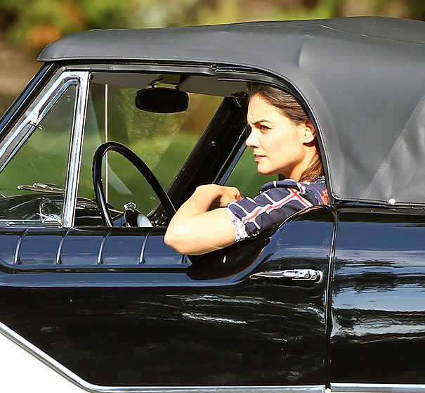 Katie Holmes jumps in a Nash Metropolitian classic car while on the set of her new film 'Miss Meadows' in Ohio